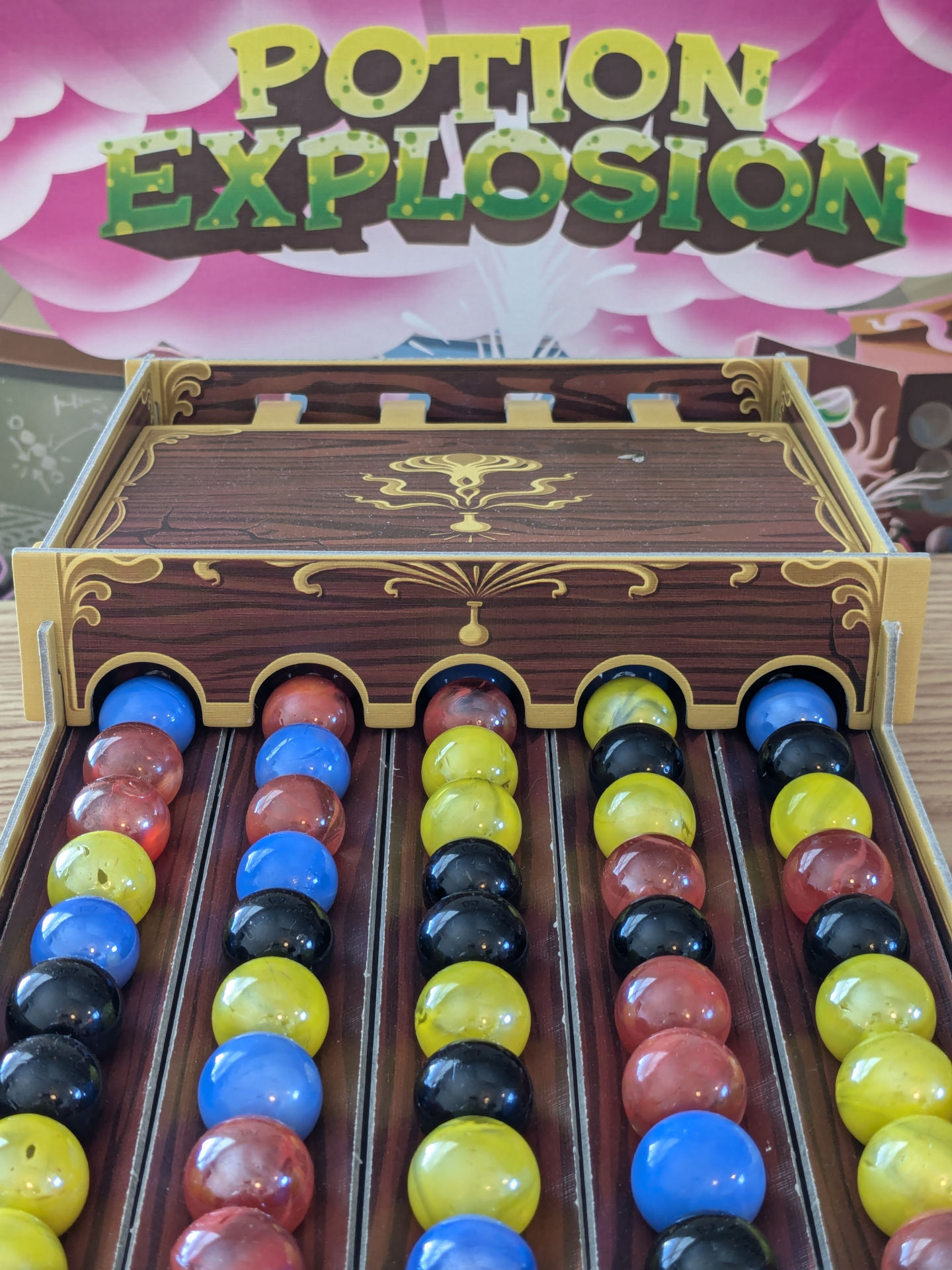 Potion Explosion dispenser and box art.